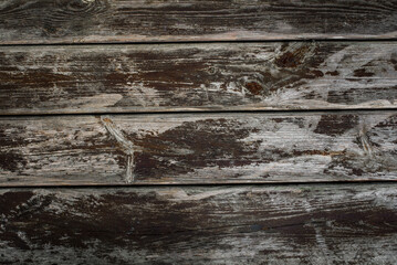 Naklejka premium Wooden background from dry old boards with scratches