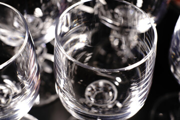 Vodka glasses on a black background. Closeup.