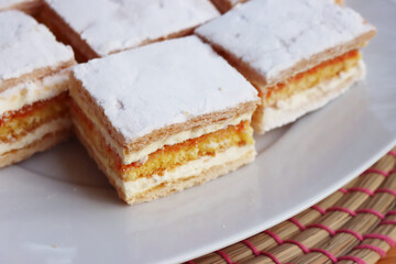 Italian traditional Diplomat or Diplomatic pastries on a plate on wooden table 