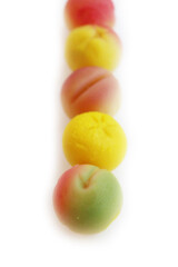 Traditional Italian Marzipan fruits isolated on white background. Sweet Marzipan shaped like fruits from Sicily