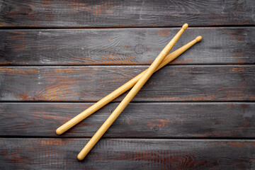 Two wooden drum sticks, top view. Music background