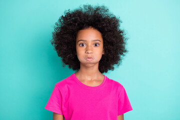 Photo portrait of funny afro american girl with puffed cheeks isolated on vivid cyan colored background - obrazy, fototapety, plakaty