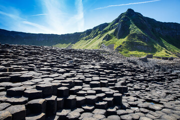 Landscape of Giant's Causeway trail with a blue sky in summer in Northern Ireland, County Antrim....