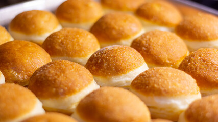 close up photo of fried doughnut with beautiful dark brown color