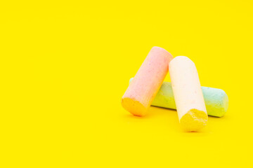 Colored chalk on a white background.Art supplies. Children's stationery. The tool of the artist. Materials for creativity. Hobby goods.