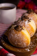 close up bombolonie on wooden plate in the table