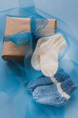 knitted socks on a wooden background