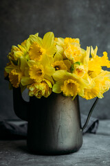Bouquet of yellow daffodils on a dark background