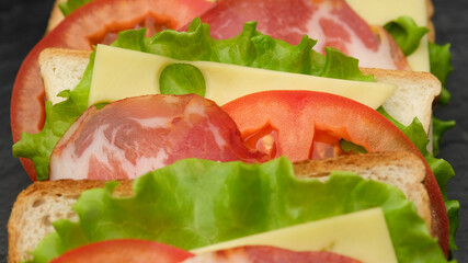 sandwich. club sandwich top view close up. large delicious natural sandwich for Breakfast or lunch. making of the fastfood at home