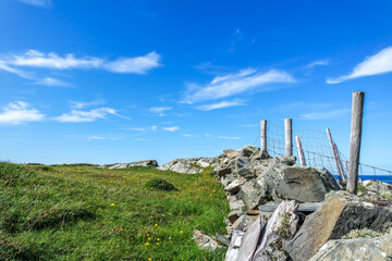 Stone wall and fence at the coastline at Dawros in County Donegal - Ireland