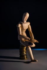 Business concept photo. Wooden man with money. Earnings and salary