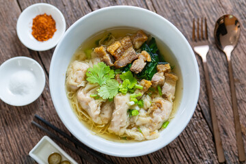 Wonton Noodles Soup with fish balls, Crispy pork, and special homemade Soup. Thai noodles soup.