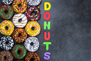 donuts with different flavors of glaze and letters of different colors