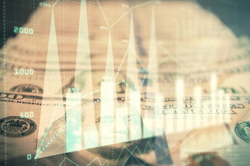 Double exposure of forex graph drawing over us dollars bill background. Concept of financial markets.