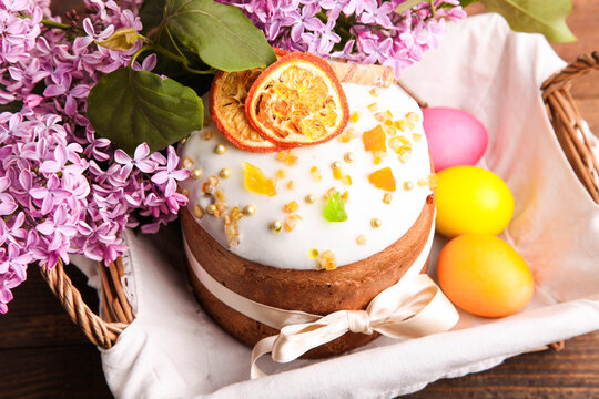 Easter cake with colored eggs and branch of lilac