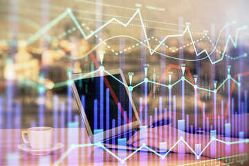 Double exposure of businesswoman hands typing on computer and forex chart hologram drawing....