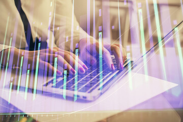 Multi exposure of woman hands typing on computer and financial graph hologram drawing. Stock market analysis concept.