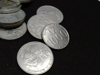 Indonesian currency coins with black background