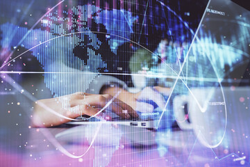 Double exposure of woman hands typing on computer and business theme hologram drawing. Success concept.