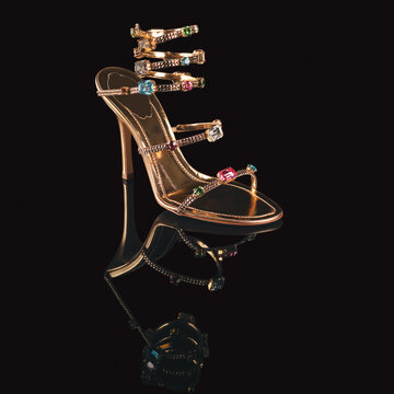 Elegant women's shoes with heels reflected on a mirror