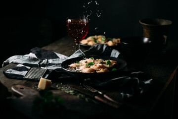 Ravioli with pumpkin and parmesan on a black plate