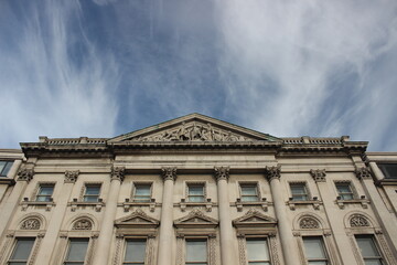 Fototapeta na wymiar Classic building front over blue sky