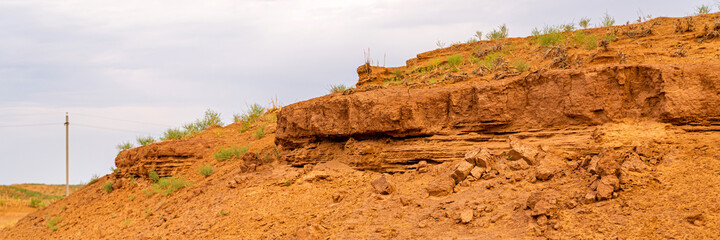 Sandy cliff with layers of soil