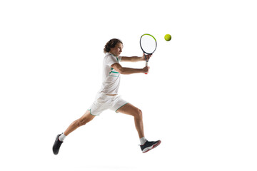 Fototapeta na wymiar Jumping. Young caucasian professional sportsman playing tennis isolated on white background. Training, practicing in motion, action. Power and energy. Movement, ad, sport, healthy lifestyle concept.