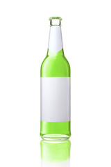 Single transparent glass bottle with blank white label. Bottle full of green drink.