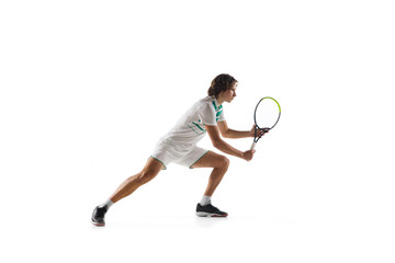 Aspiration. Young caucasian professional sportsman playing tennis isolated on white background. Training, practicing in motion, action. Power and energy. Movement, ad, sport, healthy lifestyle concept
