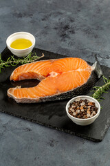 Salmon fish steak on black background