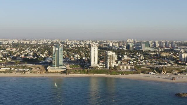 Aerial view of Herzliya coastline, with waterfront hotels and Herzliya Pituah houses.