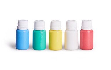 A set of white, red, yellow, green, blue acrylic paints in plastic bottles. Items isolated on a white background with clipping path which does not include shadows 