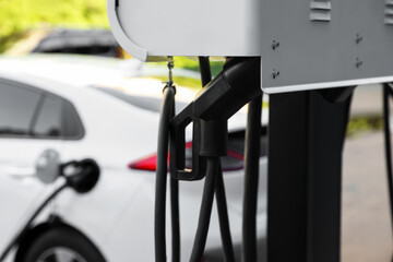 Electric vehicle charging station outdoors, closeup view