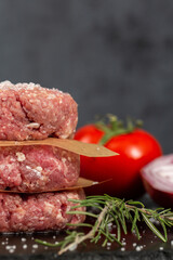 Minced beef meat for burger on black background