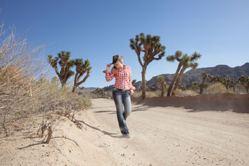 portrait of young beautiful girl in Joshua Tree park environment - 409210120