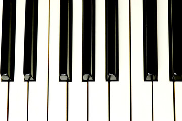 Fototapeta premium Acoustic piano keys - top angle view - directly above - background - close up