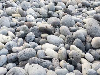 Different colors of pebbles on Reunion island east sea shore