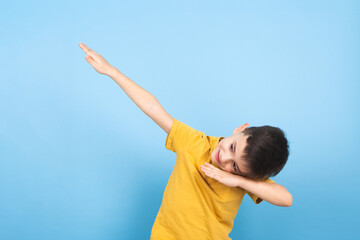 Fototapeta na wymiar a child celebrates victory with a hand gesture to the sky