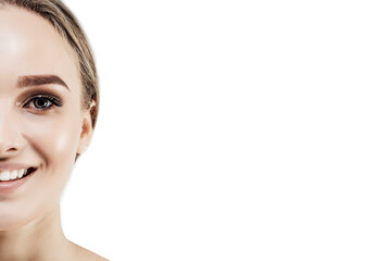 Naklejka premium White background. On a white background with space for text half the face of an attractive girl with radiant skin. Health and beauty. Place for text. Cosmetology, spa, beauty salon