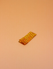 Pills on a orange background. Medicine. Health. Medication.