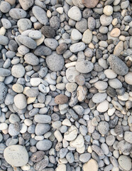 Different colors of pebbles on Reunion island east sea shore