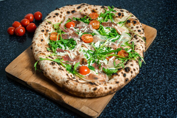 Fresh Rucola Pizza with parma ham and prosciutto
