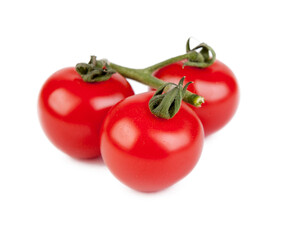 Fresh cherry tomatoes with a sprig isolated on a white background. View from another angle in the portfolio.