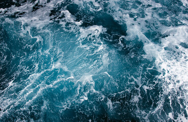 Fototapeta na wymiar Abstract blue sea water with white wave