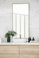 Modern bathroom interior with stylish mirror and vessel sink