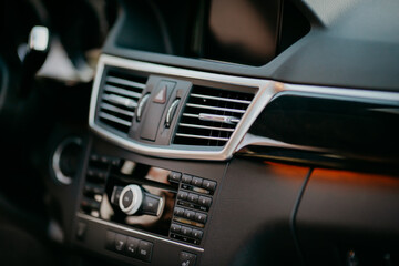 Obraz na płótnie Canvas adjustable ventilation grille on dashboard of modern car.