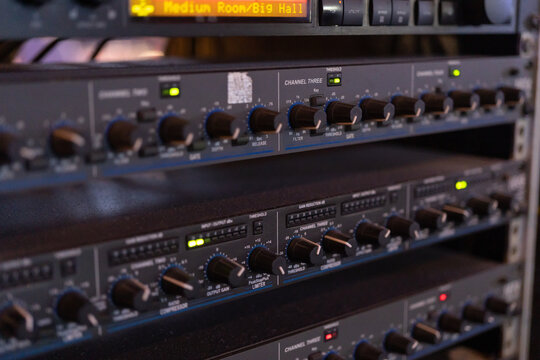 Network server of concert audio sound signal boardcast production studio panel in technology concept. Switch and patch cord cables in control data room.