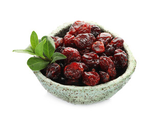 Tasty dried cranberries and leaves in bowl isolated on white