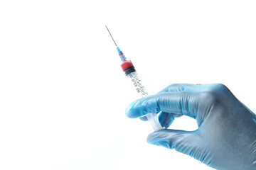 Hand in medical blue glove holding syringe. Isolated on white.